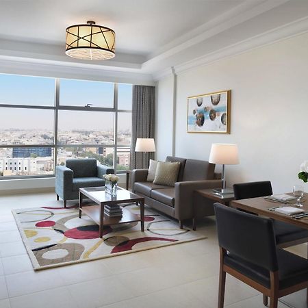 Marriott Executive Apartments Эль-Хубар Экстерьер фото A living room at the hotel